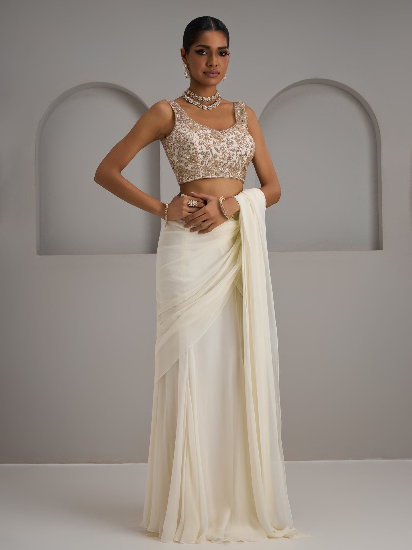 Ivory Net Halter Blouse With Drape Saree And Belt
