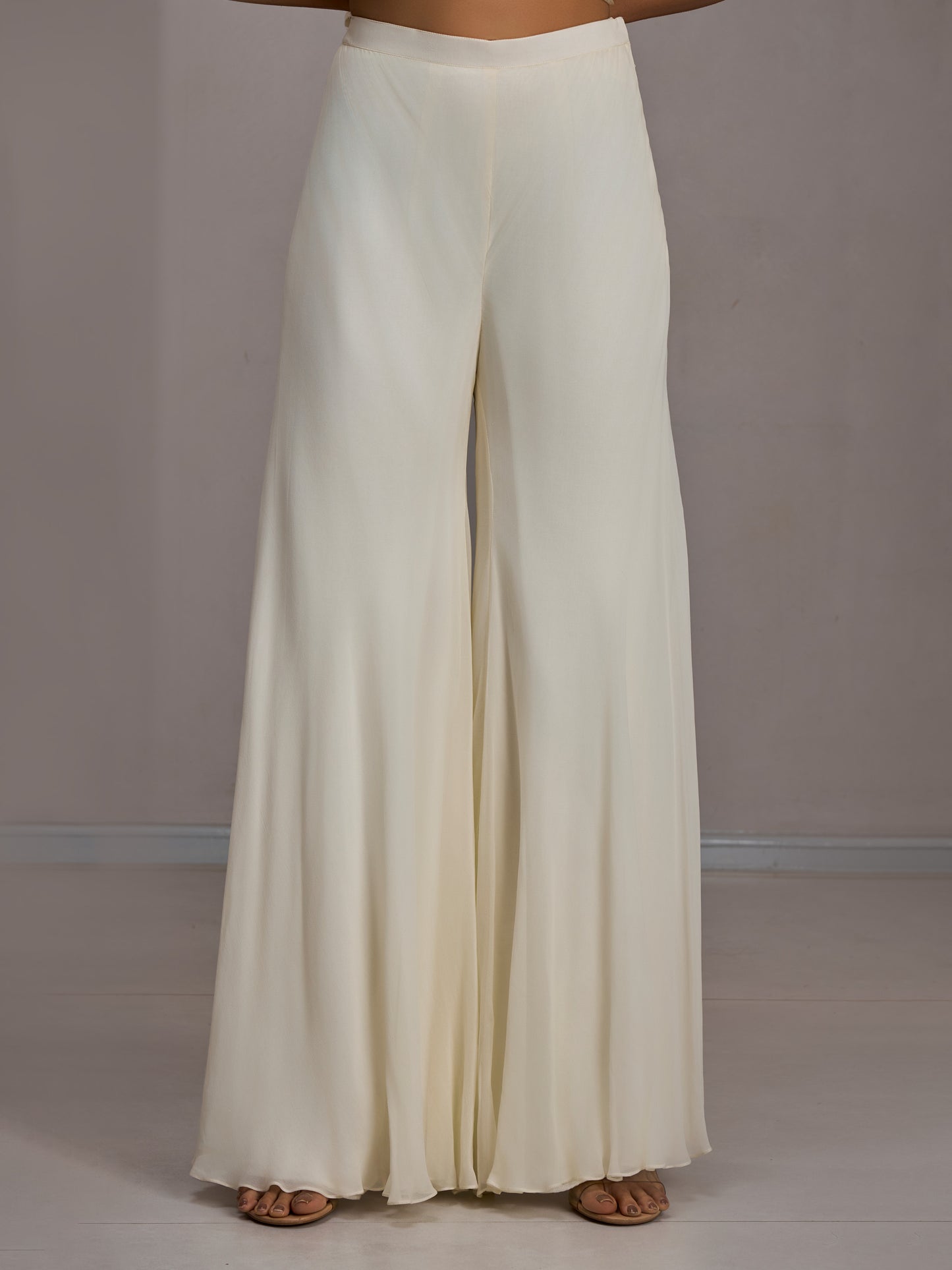 Ivory Net Crop Top With Pastel Embroidered Work And Georgette Flared Sharara Pants